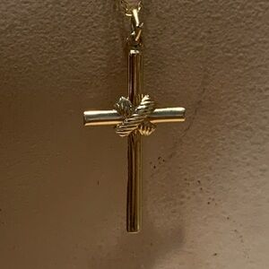 14 KARAT GOLD FILLED CROSS CRUCIFIX PENDANT ON 14 KARAT GOLD FILLED CHAIN.